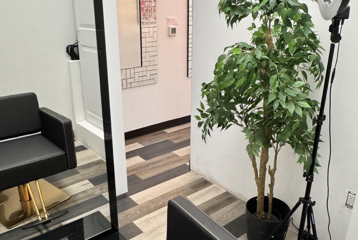 Salon Renter interior with styling chair and ring light for professional hair and beauty services.