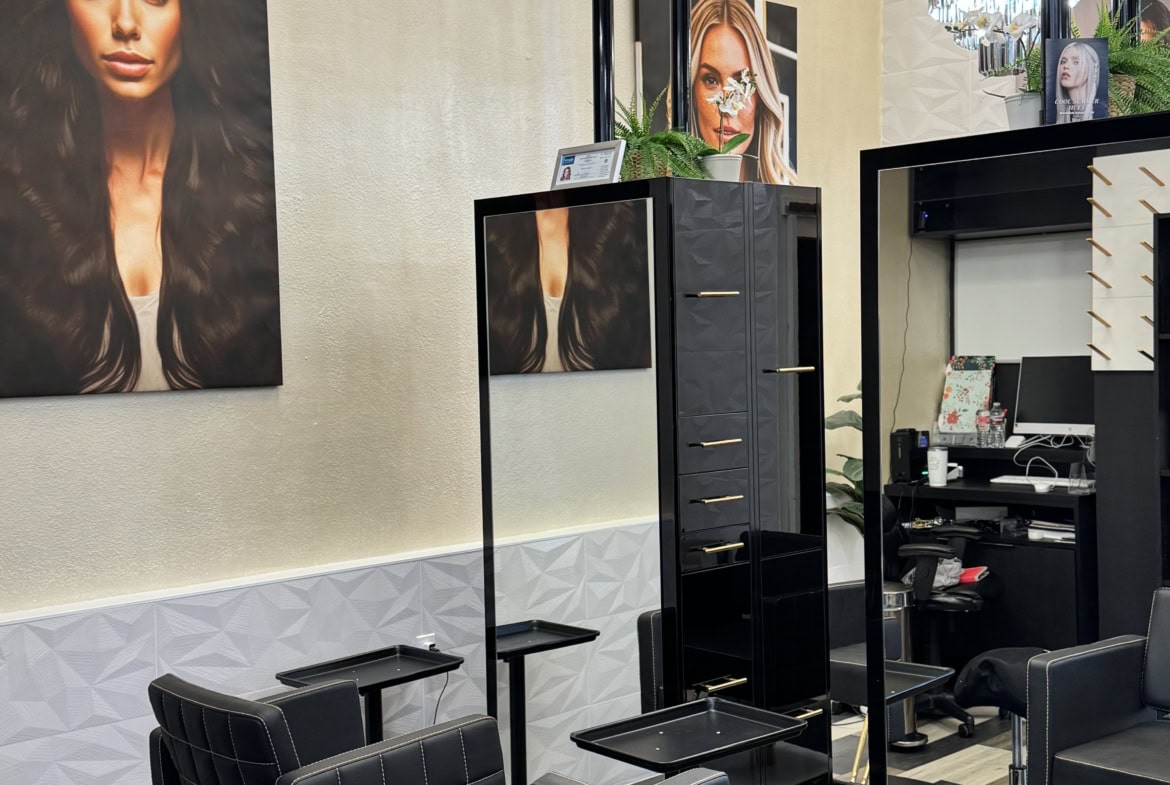 Stylish salon space with chairs, mirrors, and decor for hair and beauty services.
