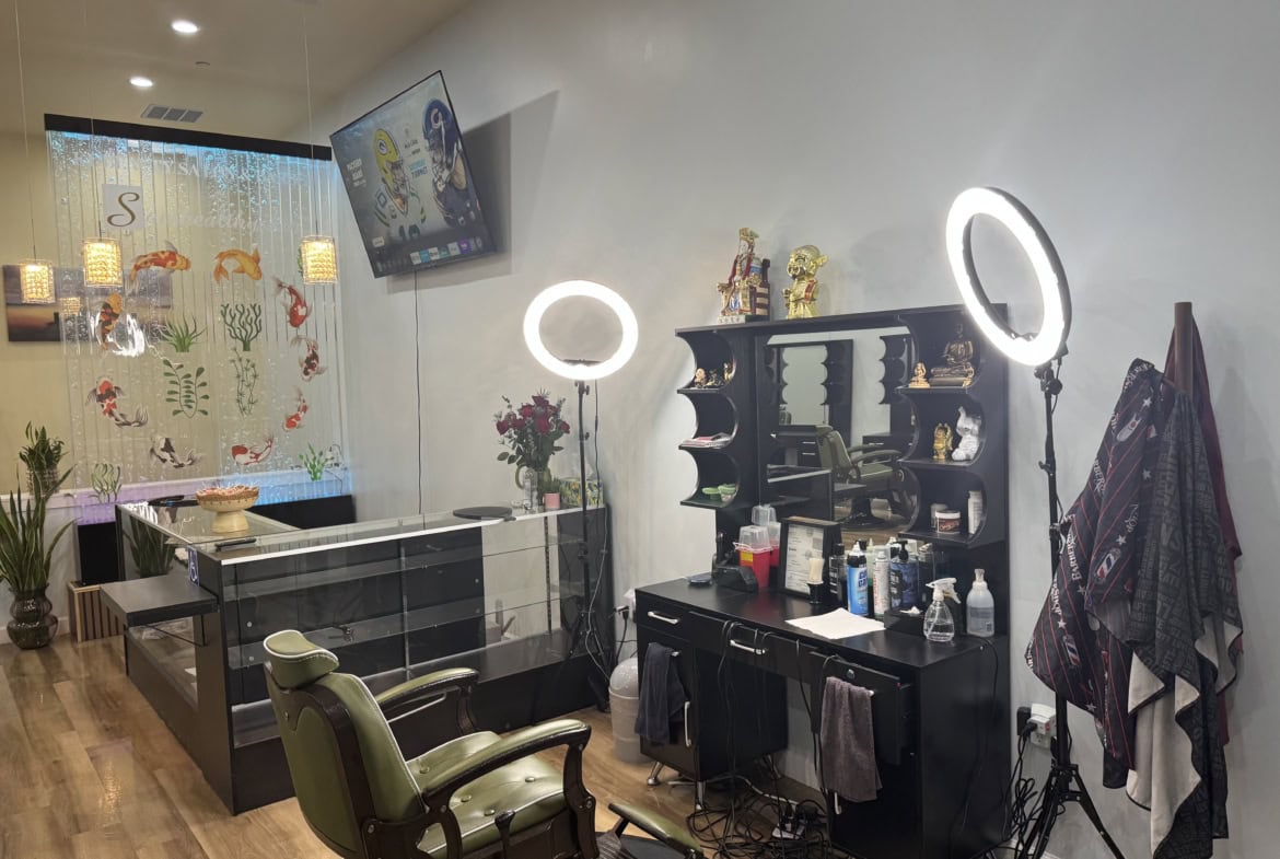 Salon Renter styling station with professional lighting and decor.