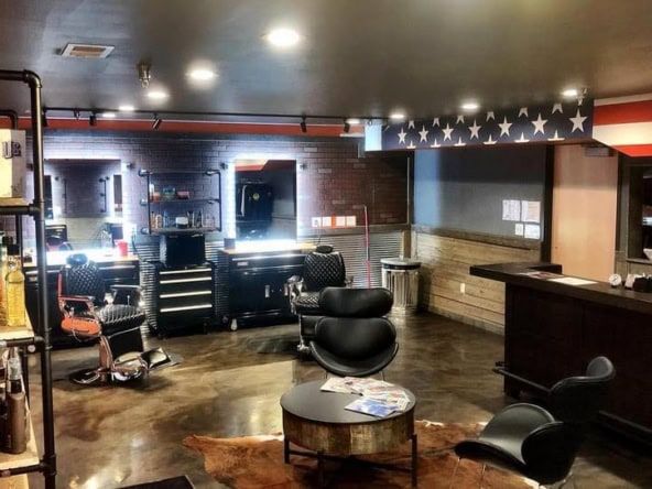 Stylish salon interior with workstations, chairs, and a welcoming atmosphere.