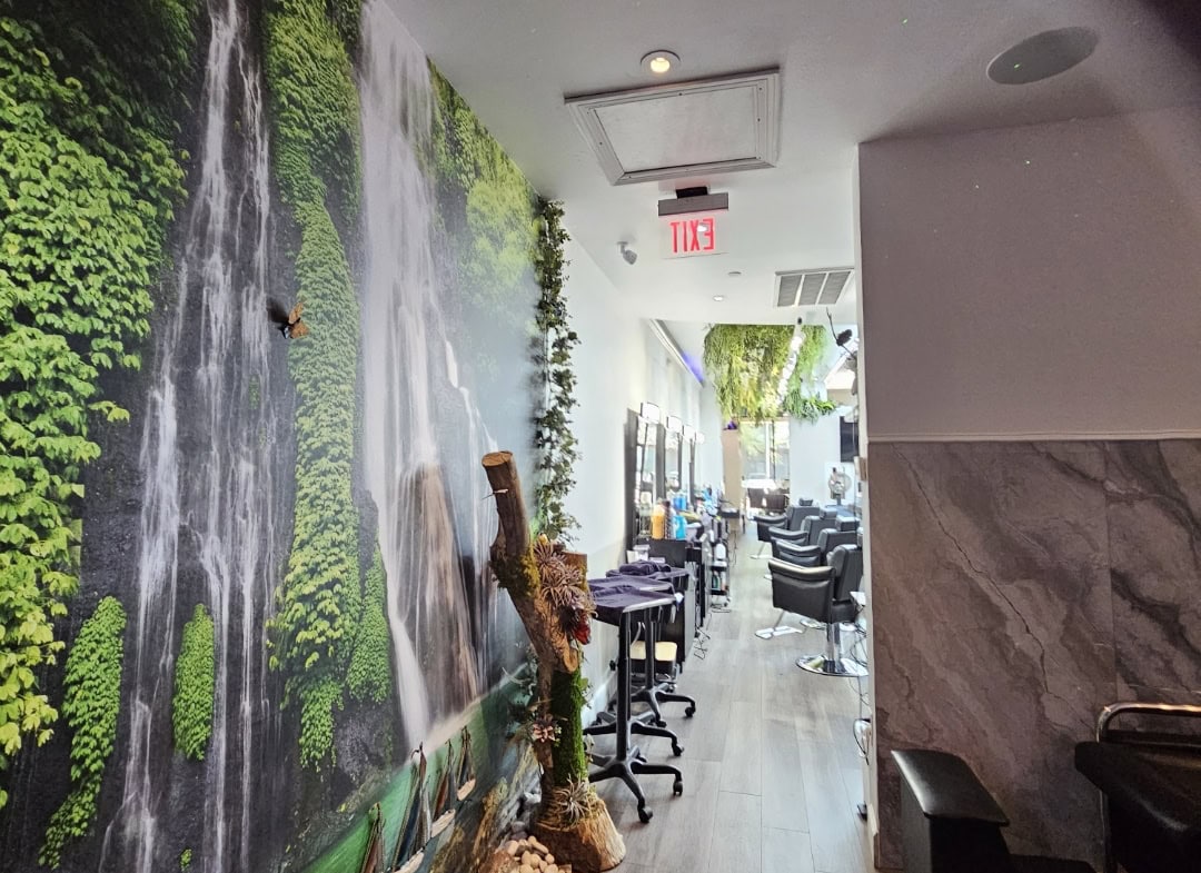 Waterfall wall art in a modern salon interior for a relaxing atmosphere.
