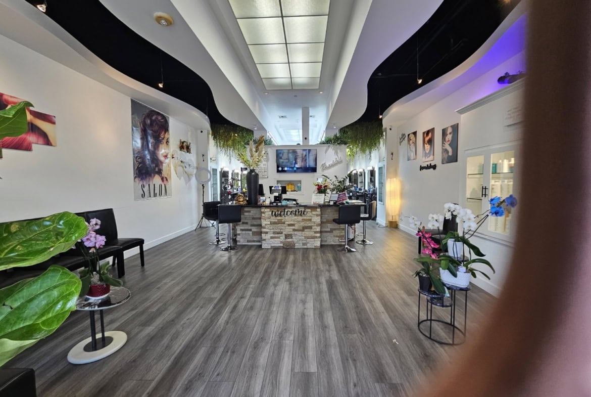 Modern salon interior with sleek design, stylish decor, and ambient lighting for a welcoming client.