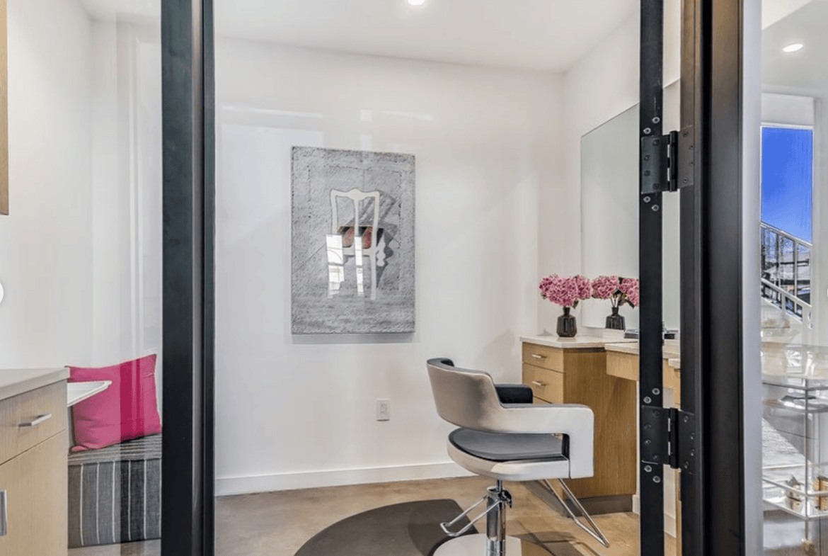 Modern salon suite with a styling chair, mirror, and decor for beauty professionals. Perfect for ren.