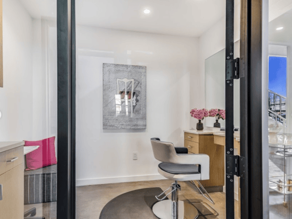 Modern salon suite with a styling chair, mirror, and decor for beauty professionals. Perfect for ren.