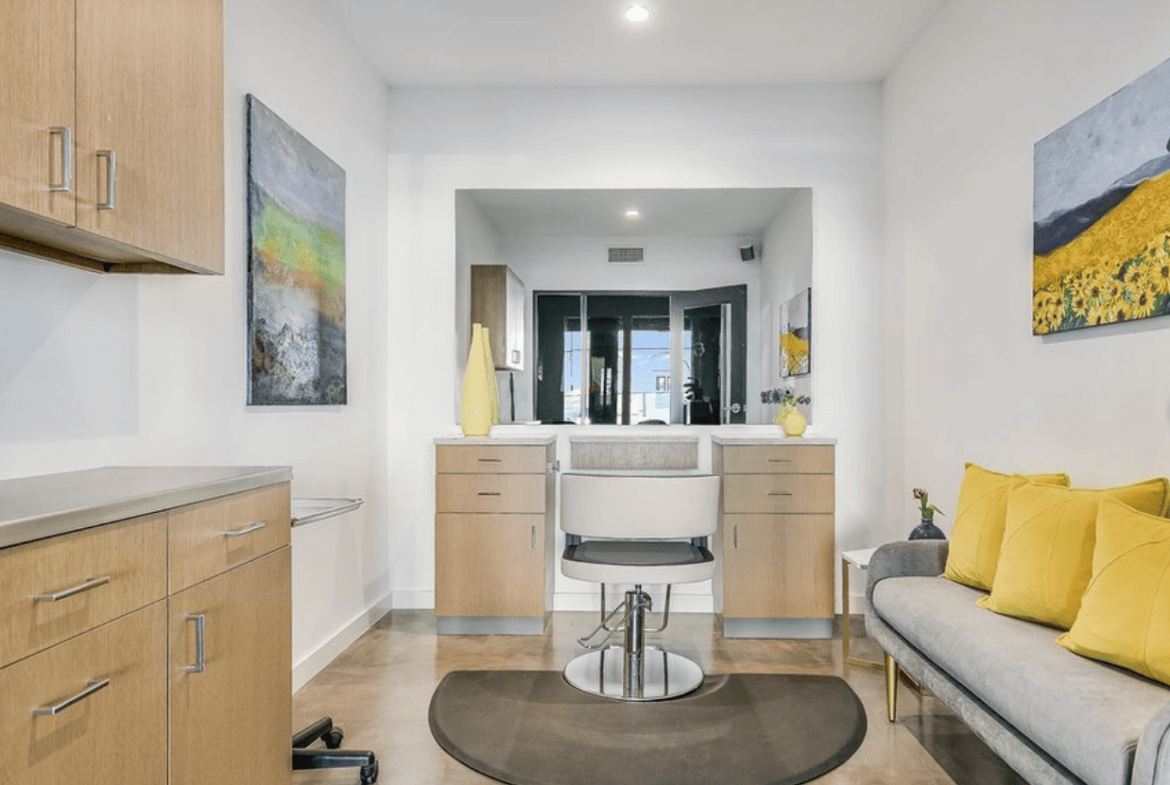 Modern salon suite with bright, inviting decor and stylish artwork. Perfect for beauty professionals.