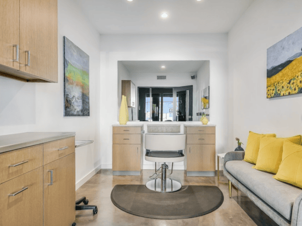 Modern salon suite with bright, inviting decor and stylish artwork. Perfect for beauty professionals.