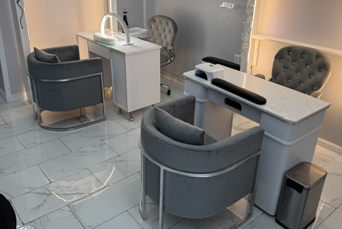 Salon Renter modern salon reception area with stylish chairs, white decor, and elegant lighting for.