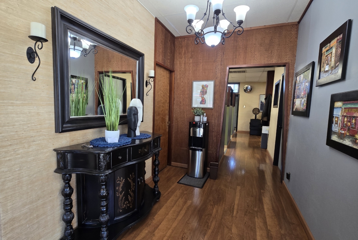 Modern salon interior hallway with artwork and stylish decor.