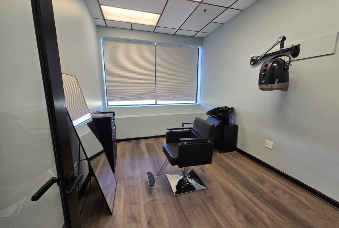Salon Renter modern salon studio with styling chair, mirror, and hairdressing equipment for rent.