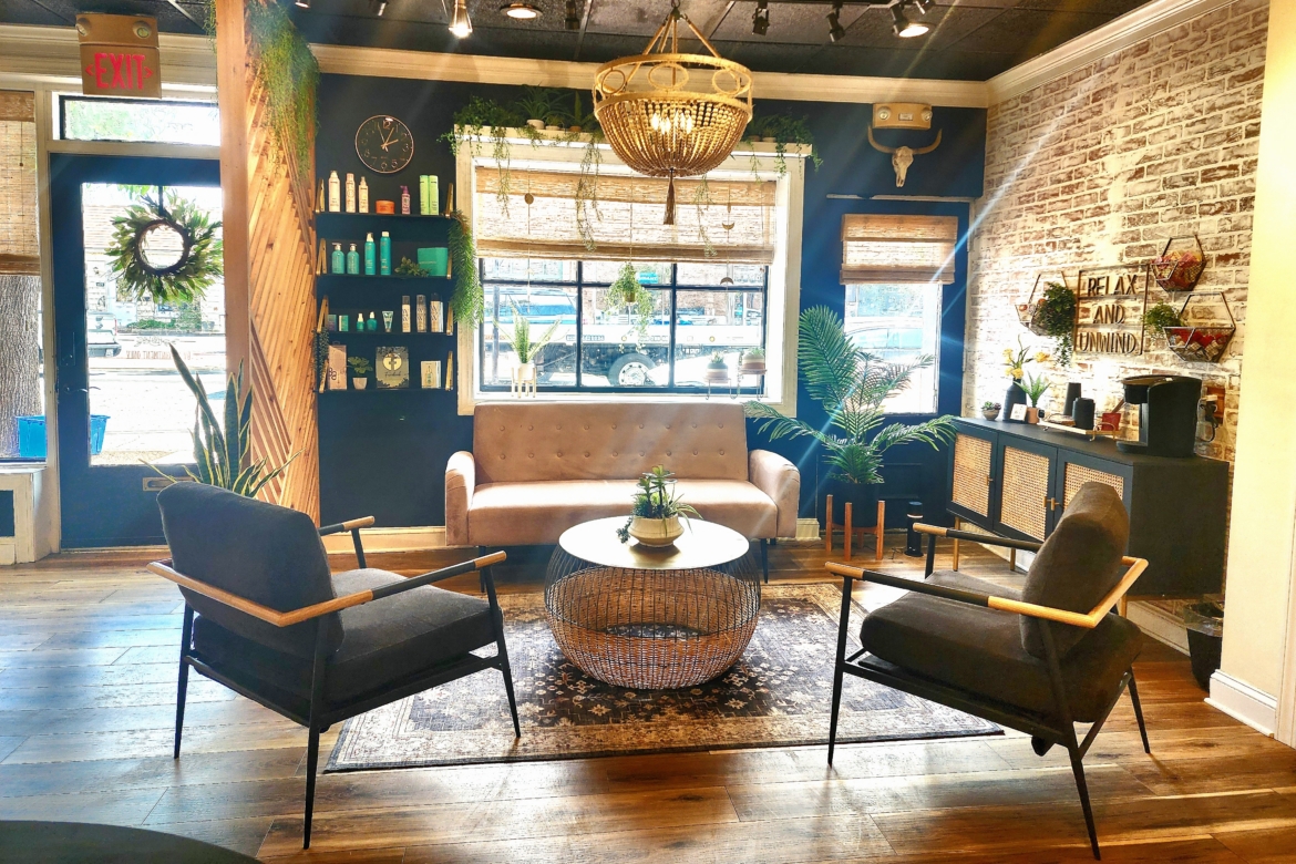 Stylish salon waiting area with comfortable seating and vibrant decor.