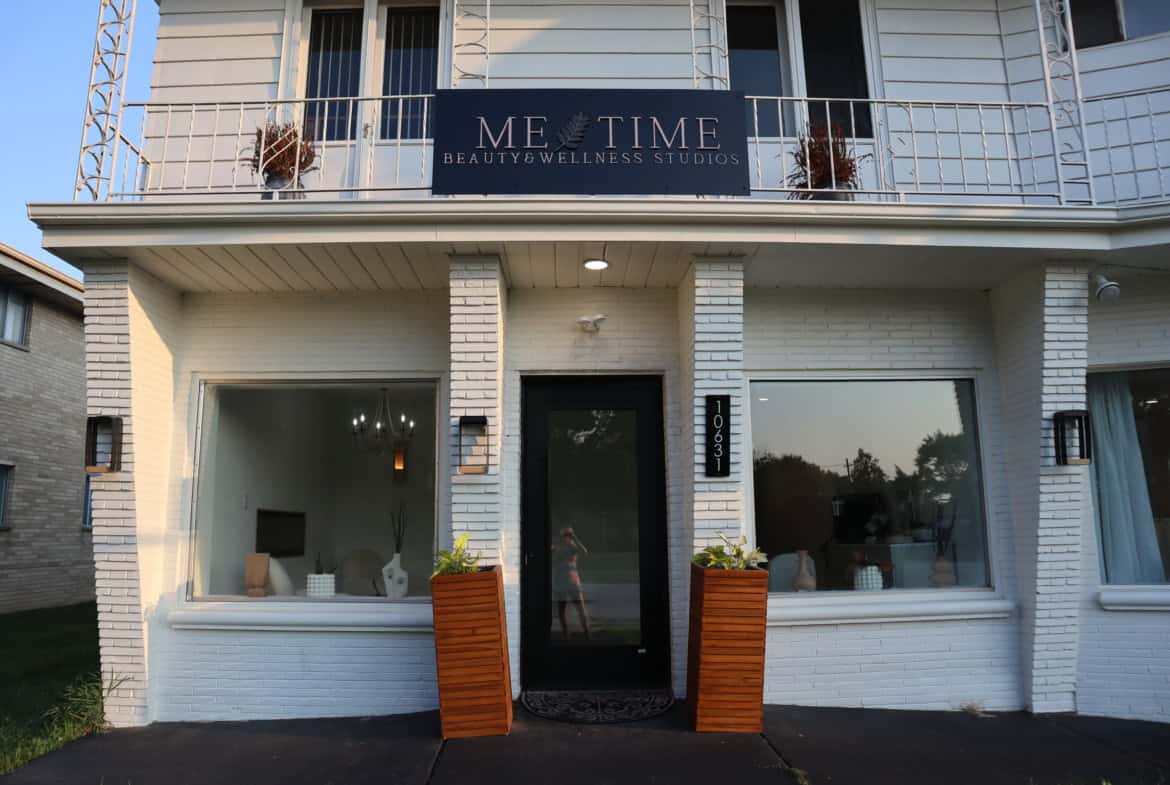 Modern salon storefront with welcoming entrance and large windows.