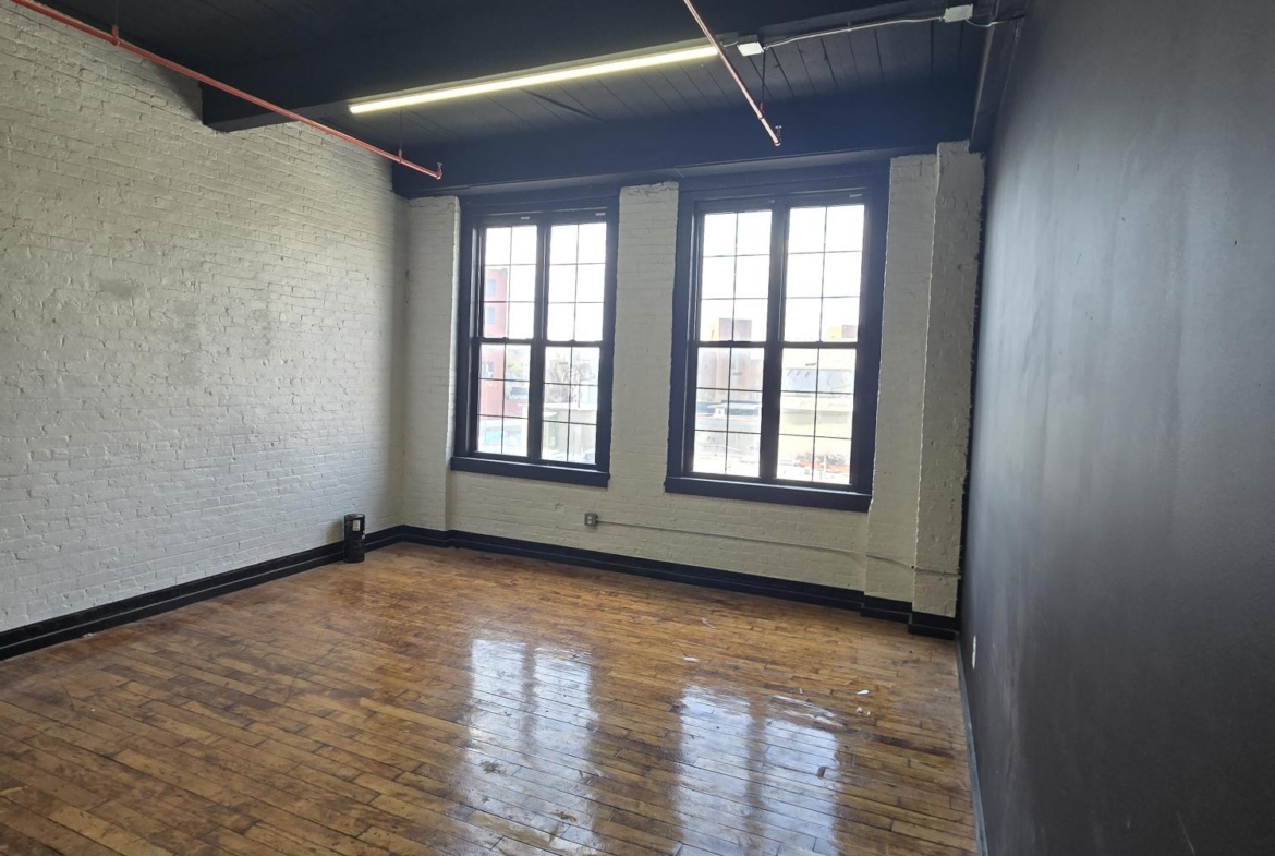 Spacious salon interior with natural light and stylish decor.