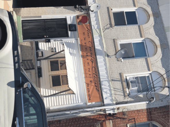 Historic building with modern signage, located in an urban area.