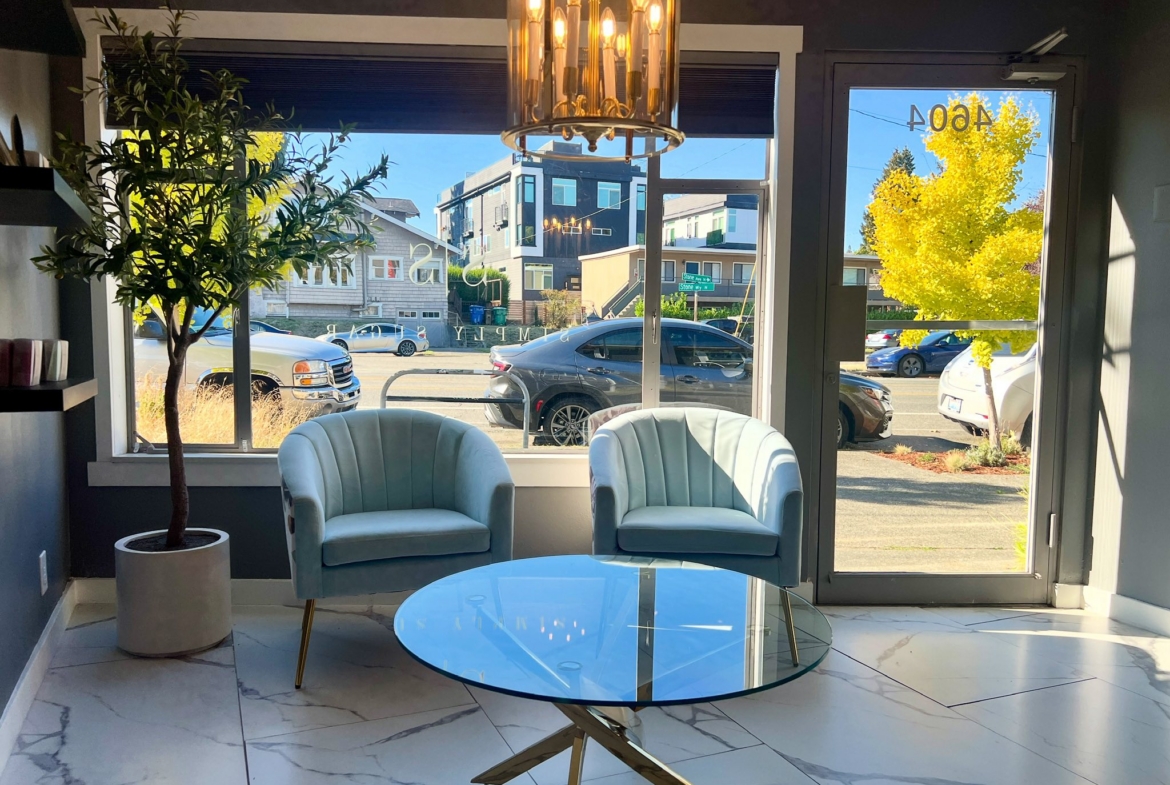Contemporary salon interior featuring comfortable seating and natural light.