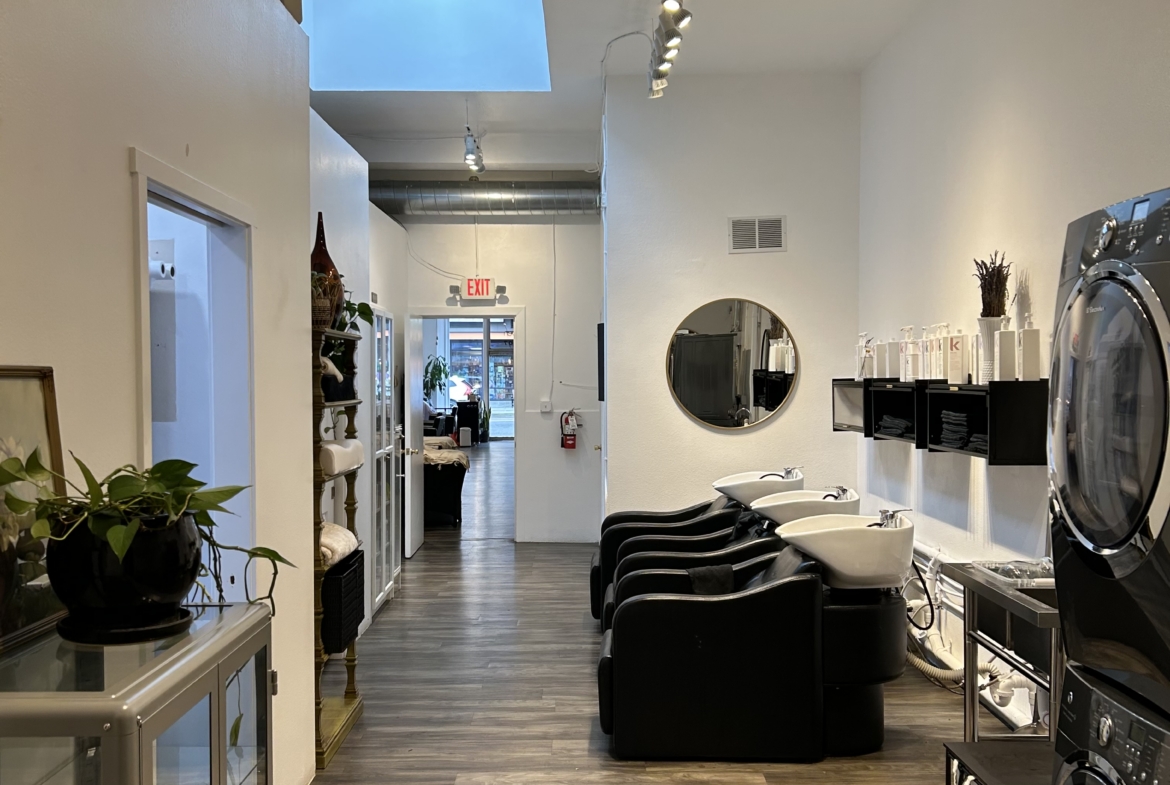 Salon Renter modern hair salon with styling stations and washing sinks.