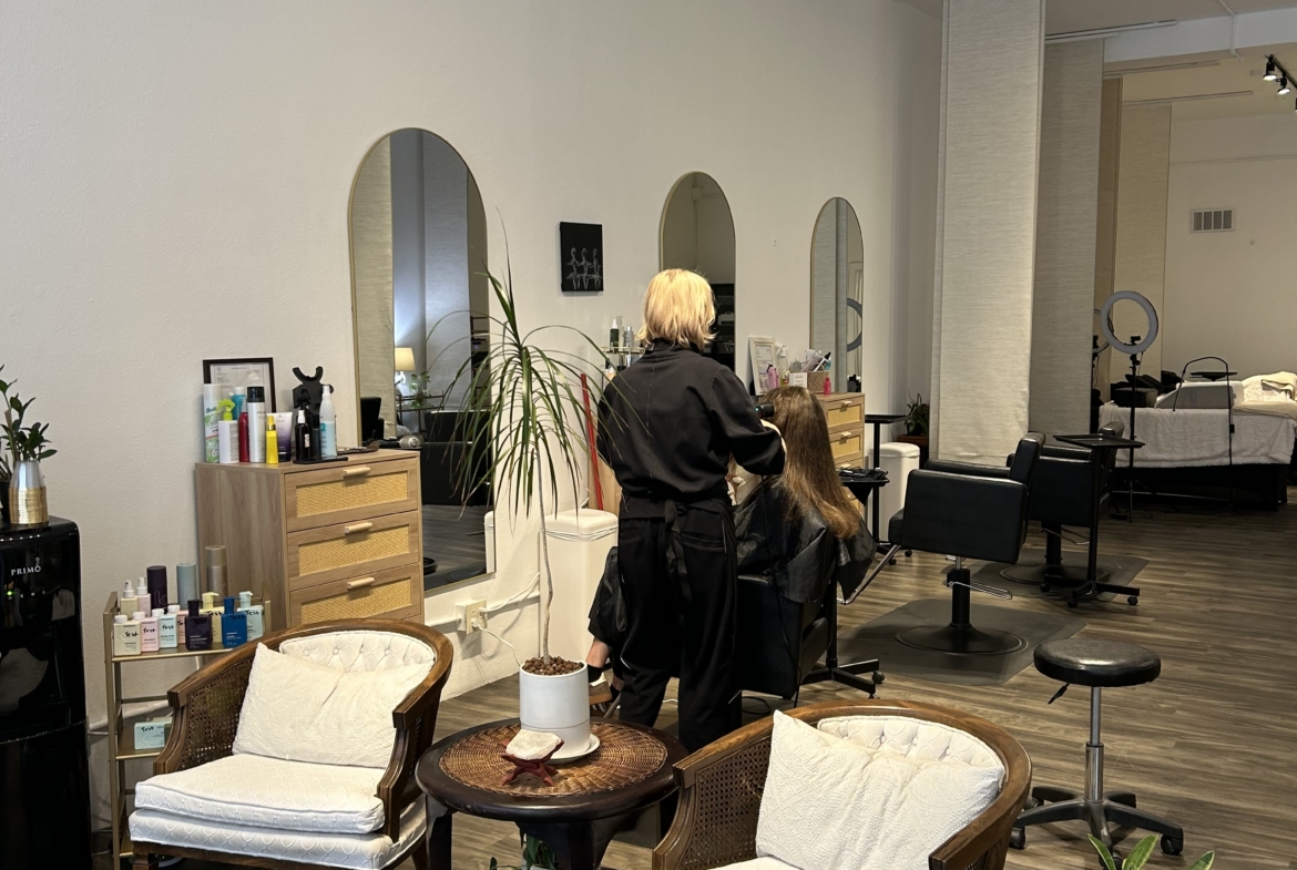 Salon Renter interior with styling station and seating area for clients and stylists.