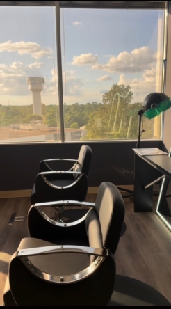 Salon Renter modern salon interior with chairs and large window for natural light.