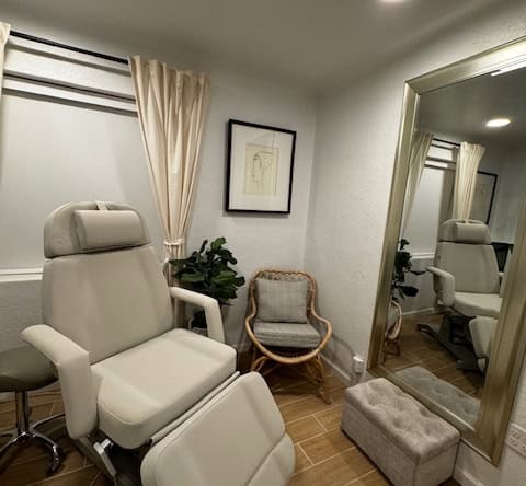 Salon Renter treatment room with comfortable chair, mirror, and cozy decor for professional beauty s.