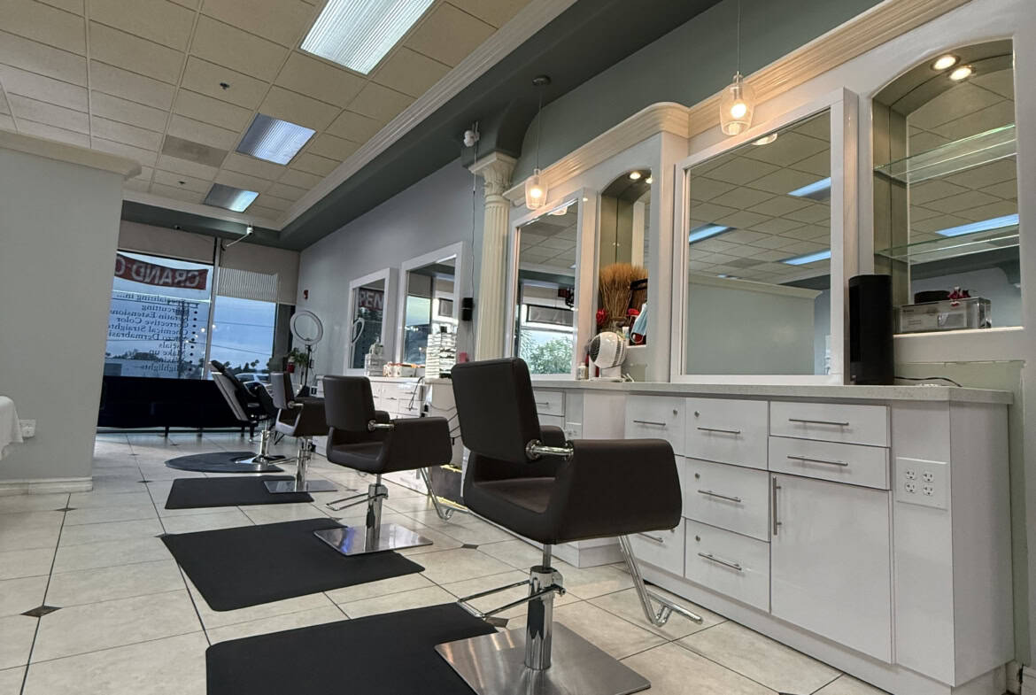 Salon Renter modern hair salon with styling stations and mirrors.