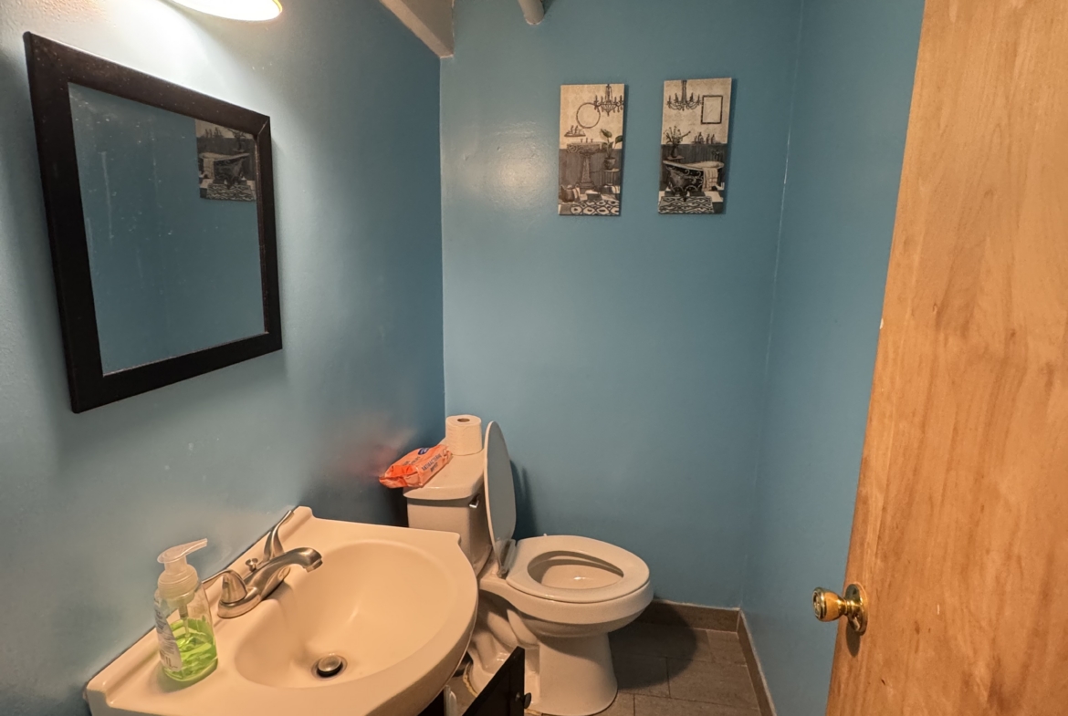 Clean and functional restroom space ideal for salon staff or clients.