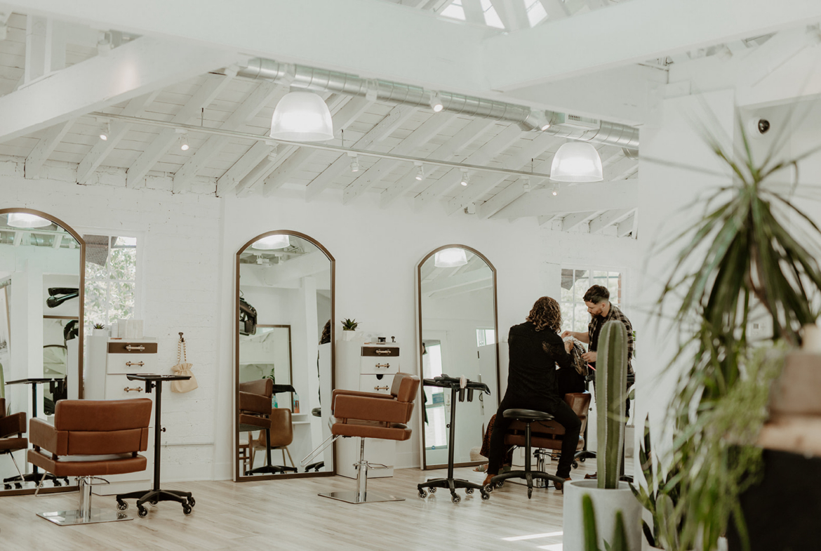 Stylish salon with modern stations and professional hair services.