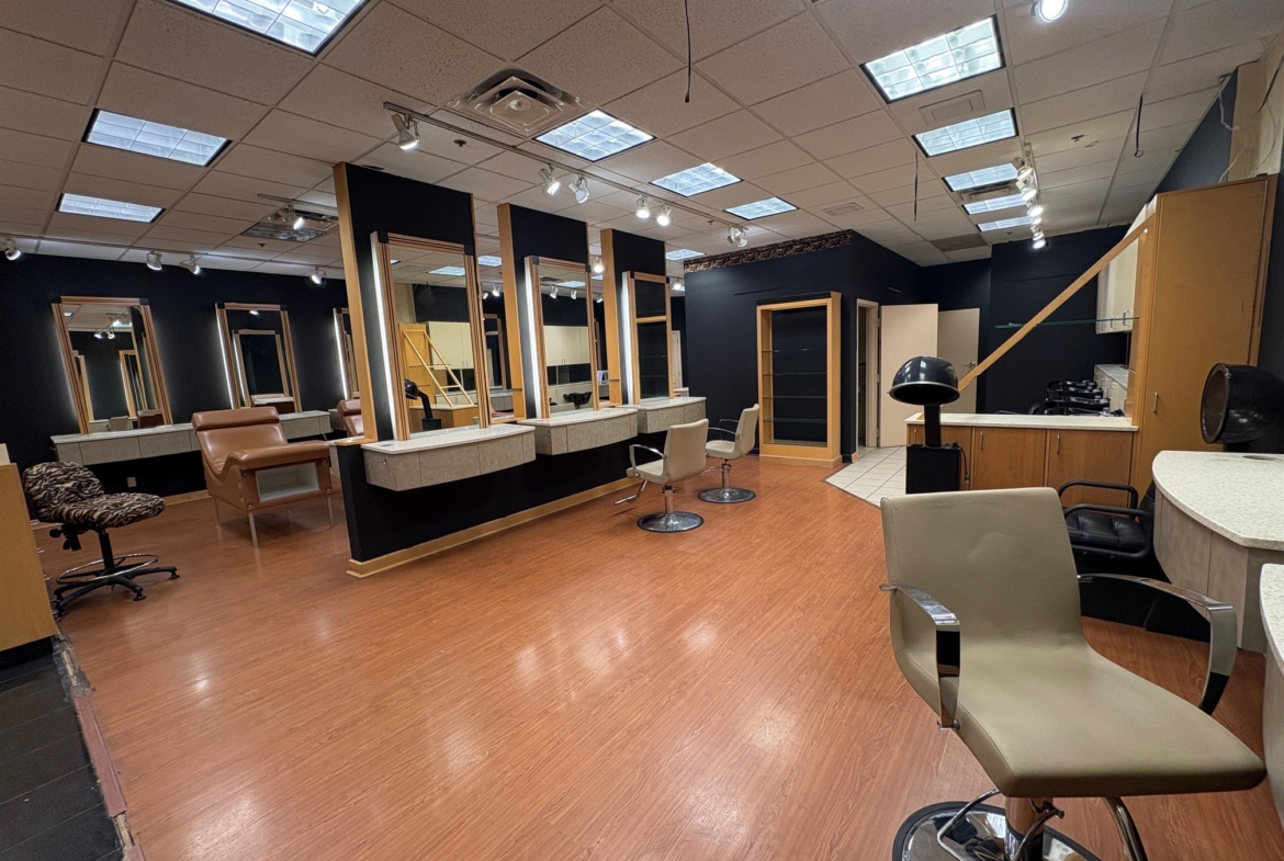 Salon Renter modern styling station with mirrors and chairs for hairdressing services.
