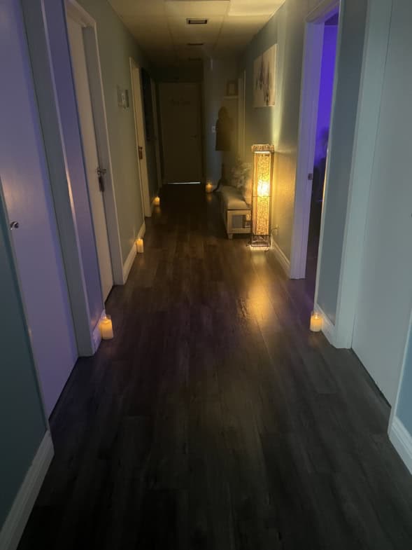 Relaxing spa corridor illuminated by candles and soft lighting, creating a calming atmosphere for cl.