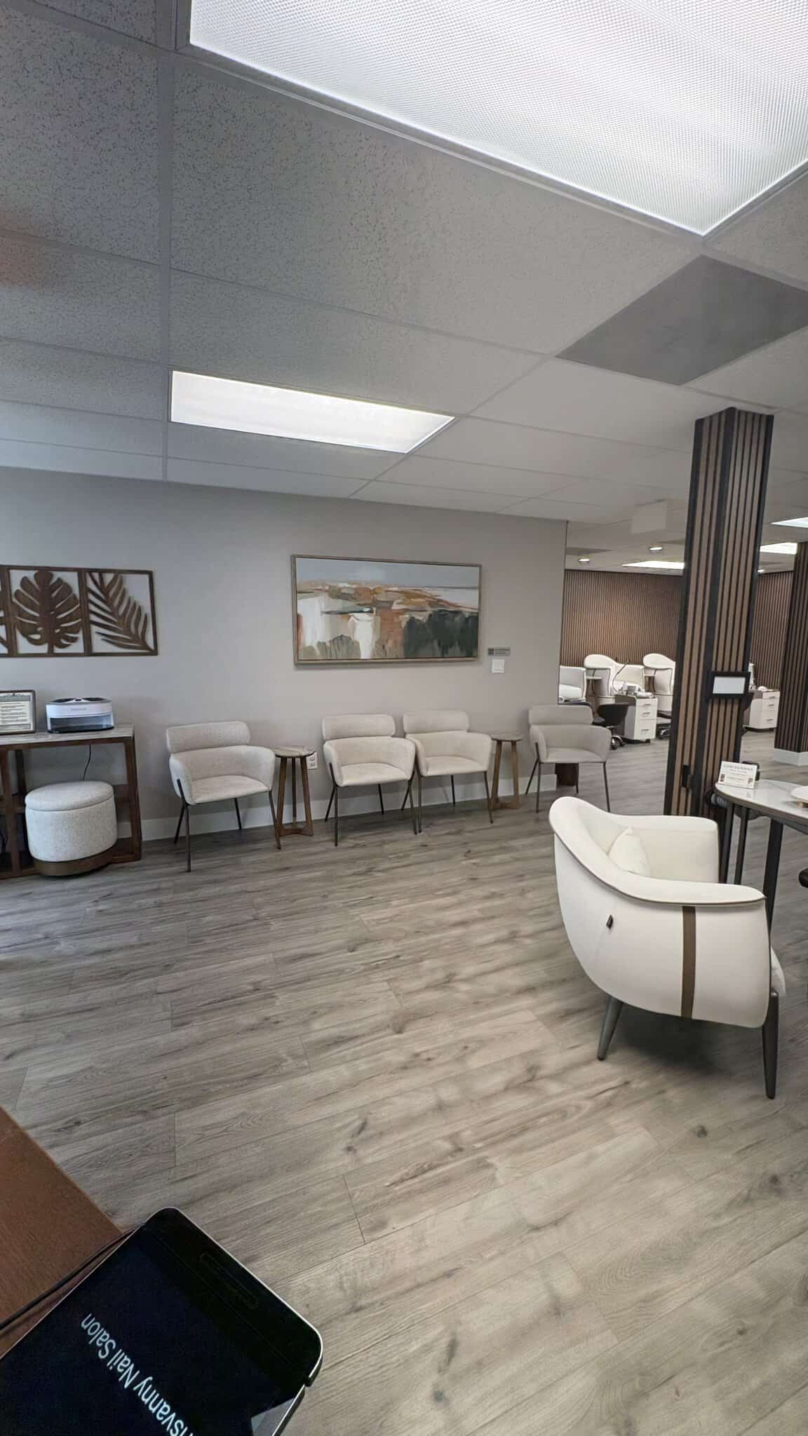 Stylish salon waiting area featuring comfortable chairs, modern decor, and calming ambiance for clie.