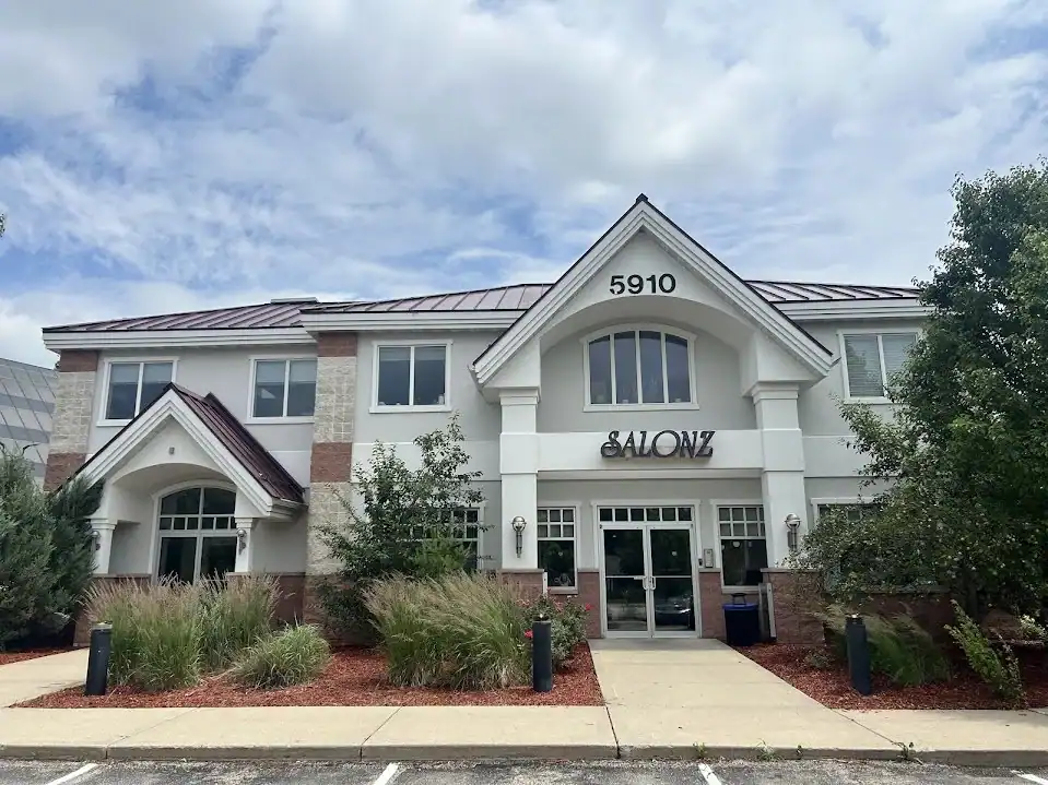 Modern salon rental office building with welcoming entrance and landscaping.