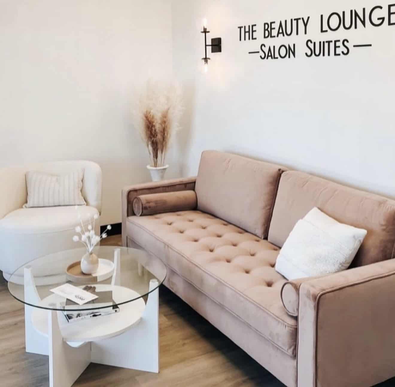 Elegant salon lounge with comfortable seating and modern decor.