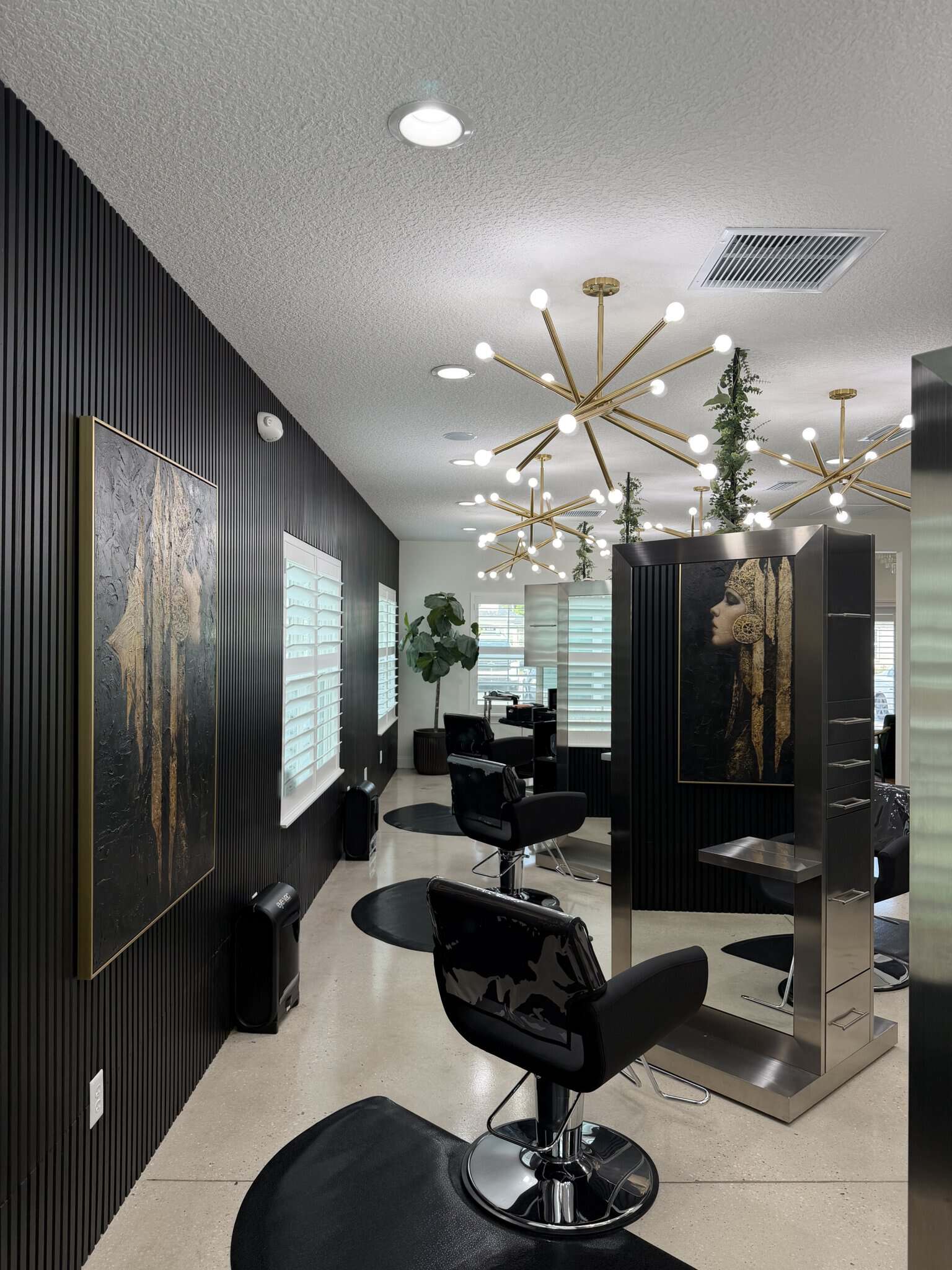 Stylish salon with modern chairs, mirrors, and contemporary lighting for a professional hair styling.